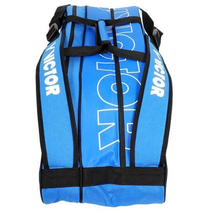 The Victor Multithermo 9031 Badminton Bag in blue, featuring black straps and prominent white "VICTOR" text, is ideal for racket sports. It includes a practical shoe compartment to help keep your gear organized.