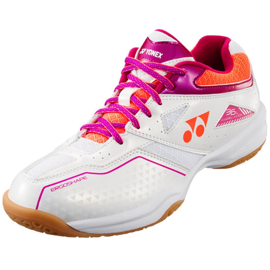 Introducing the Yonex Power Cushion 36 Women's Badminton Shoes in White and Coral. These shoes, crafted by Yonex, feature the renowned Power Cushion technology for superior impact protection. They boast orange accents, a non-marking gum sole, and are detailed with a side logo and "Ergoshape" text near the toe. The design is completed with pink laces and a textured finish.