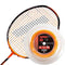 A predominantly black badminton racket with orange strings is complemented by a spool of Ashaway Zymax 68 TX Badminton String in Orange. This string features 0.68mm gauge and showcases the advanced ZyWeave string technology, with its packaging emphasizing innovative BETA polymer fibers for enhanced performance.