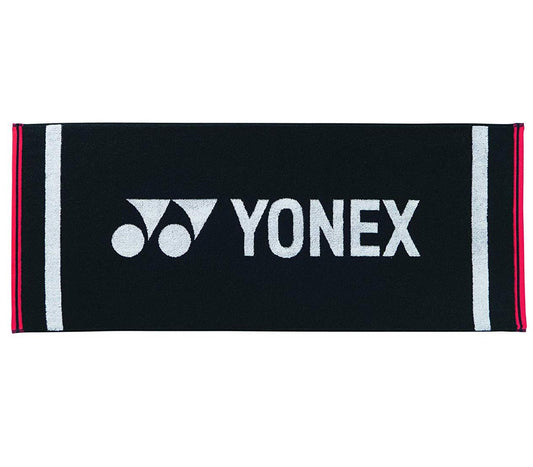 The Yonex AC1105EX Black Badminton Sports Towel, measuring 40 x 100 cm, features the iconic Yonex logo and name in white with elegant red stripes running along the edges on the sides.