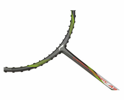 Close-up of a badminton racket frame showcasing the brand name "Li-Ning" on the shaft. This model, known as the Li-Ning Carbon Series A900, features a Dynamic-Optimum Frame design. The frame is elegantly grey with striking green accents.