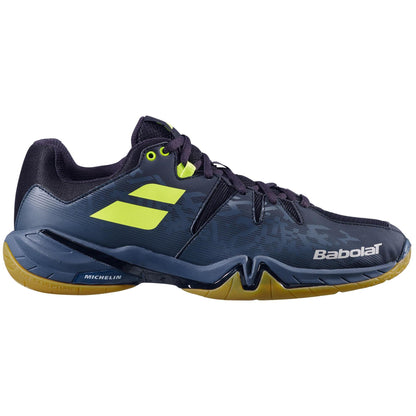 The Babolat Shadow Spirit Badminton Shoes in black feature vivid neon yellow accents and a sturdy gum sole. Branded with "Babolat" and a subtle "Michelin" label, these shoes utilize dependable Michelin rubber to boost performance.