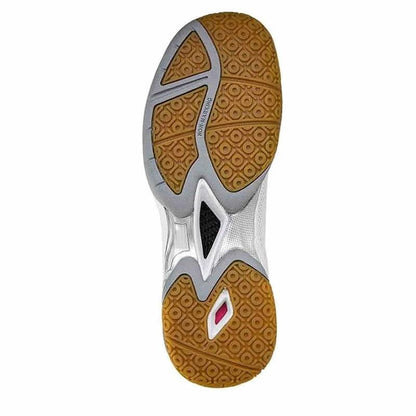 The image displays the sole of a sports shoe, exhibiting a distinctive tread pattern similar to the FZone Grip technology. The design includes a combination of brown, black, and white colors with geometric elements and textured grip for superior traction, offering performance comparable to the FZ Forza Fierce V2 White Badminton Shoes from FZ Forza.