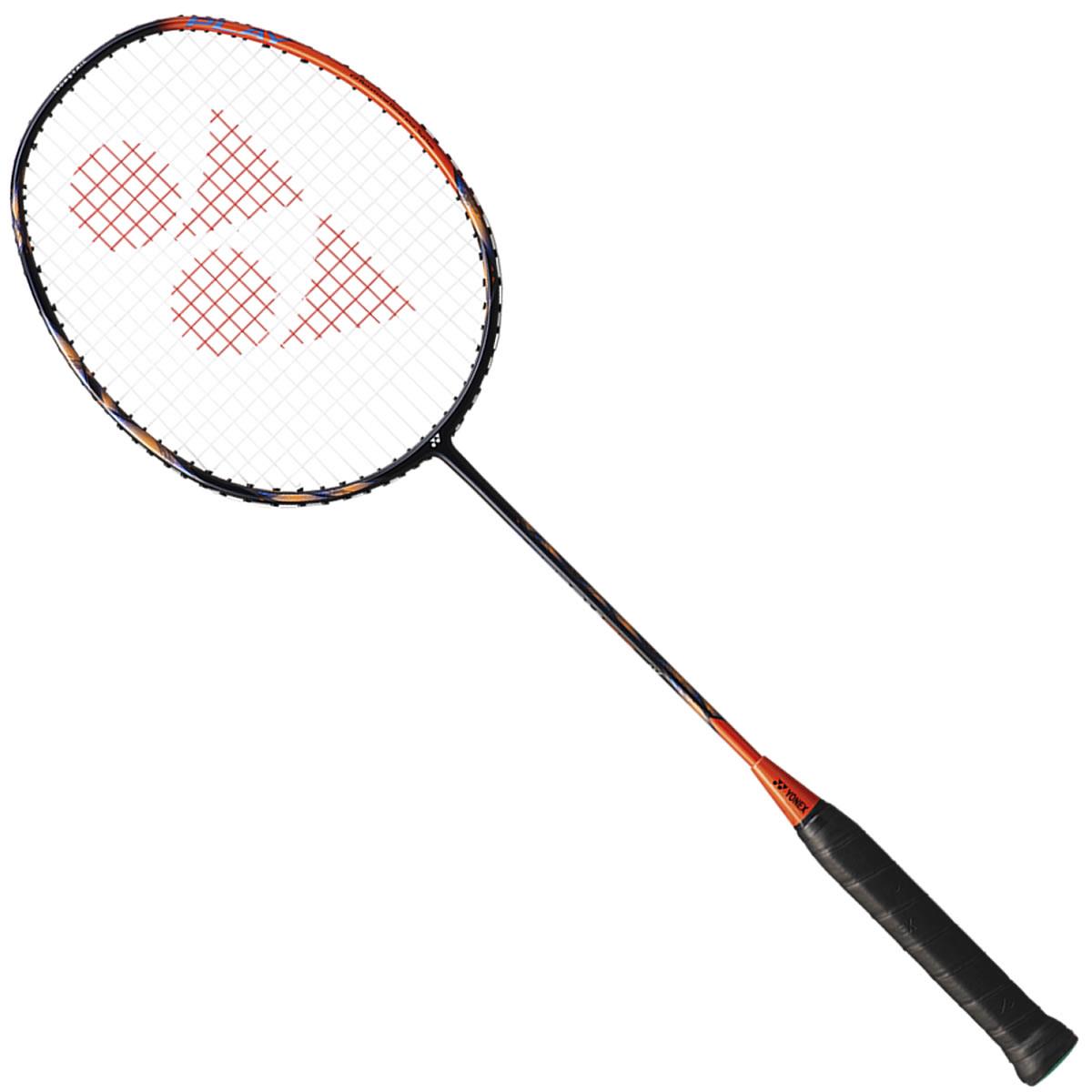 The Yonex Astrox 77 Play 4U Badminton Racket - High Orange is a stylish graphite racket that incorporates ISOMETRIC technology. It features a black design accented with an orange trim and showcases the logo pattern on its strings. The handle, covered in black grip tape, emphasizes its premium quality as it leans diagonally against a white background.