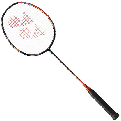 The Yonex Astrox 77 Play 4U Badminton Racket - High Orange is a stylish graphite racket that incorporates ISOMETRIC technology. It features a black design accented with an orange trim and showcases the logo pattern on its strings. The handle, covered in black grip tape, emphasizes its premium quality as it leans diagonally against a white background.