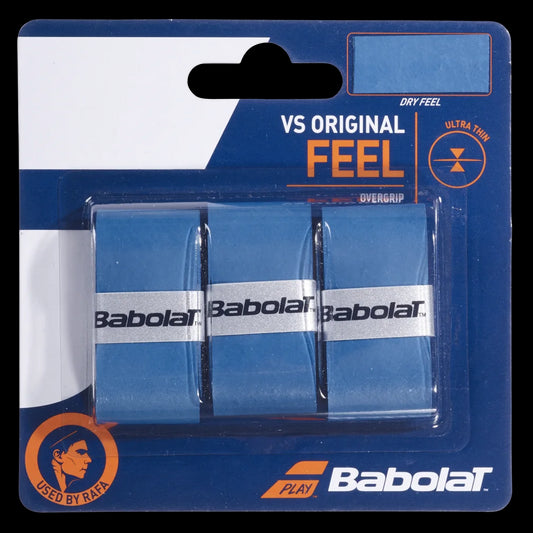 The packaging of the Babolat VS Original X3 Badminton Overgrip - Blue displays three blue overgrips with white Babolat branding. Featuring the terms "Dry Feel" and "Ultra Thin," it includes a "Used by Rafa" icon at the bottom left, underscoring its superior absorption qualities.