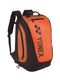 The Yonex Pro Badminton Backpack M 92012 in Copper Orange is ideal for badminton enthusiasts, offering a substantial front pocket, side zip closures, cushioned shoulder straps, and a convenient top handle.