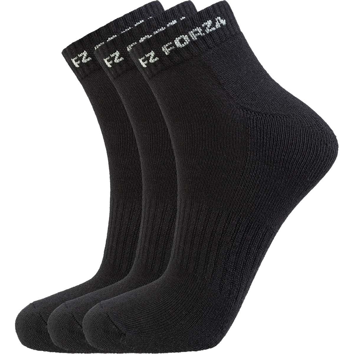 A set of three FZ Forza Comfort Short Black Badminton Socks is neatly organized, each pair displaying "FOR24" in white near the cuffs. These socks by FZ Forza boast a ribbed texture and look soft and stretchy, making them ideal comfort socks for any activity.