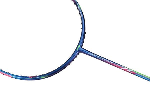 A close-up of the Li-Ning Windstorm 72 6U Badminton Racket in dark blue, featuring colorful accents on the frame and shaft, set against a white background. The racket's circular head and slim ultra-lightweight design are crafted for maximum speed and standout performance.