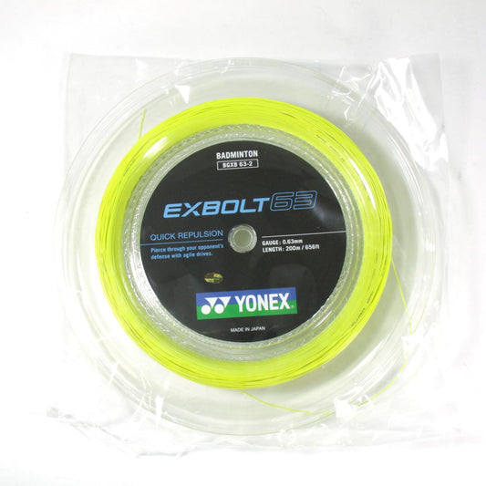 The Yonex Exbolt 63 Badminton String Yellow - 0.63mm 200m Reel features a thin gauge designed for enhanced play. The strings, coiled inside clear plastic wrap, have a neon yellow color, a diameter of 0.63mm, and extend to a length of 200m, ensuring excellent durability for your game.