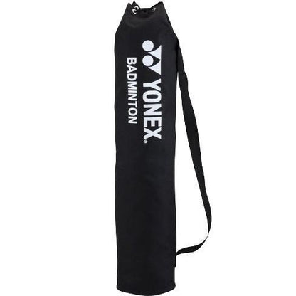 A Yonex AC334EX Portable Badminton Net with black design and white lettering, featuring a shoulder strap to hold equipment. Its cylindrical shape complements a compact carry case for easy transport.